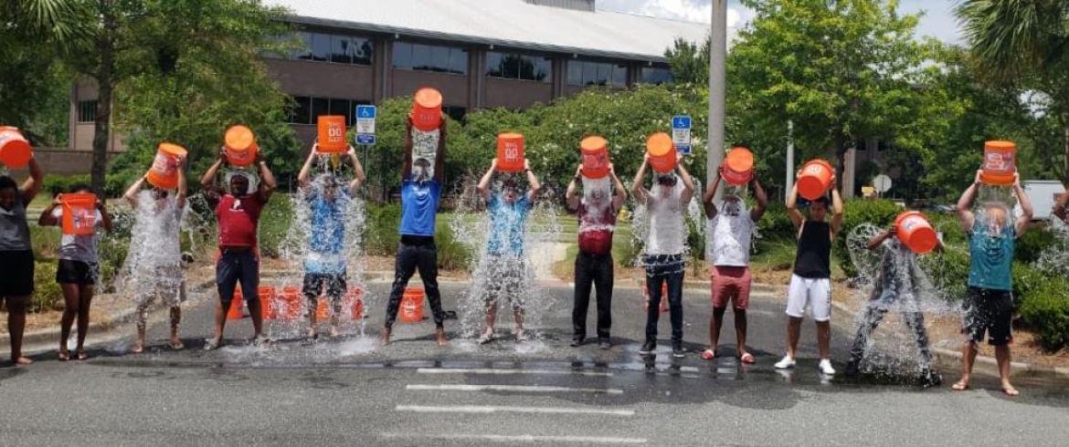 Students dumping ice cold water over their heads