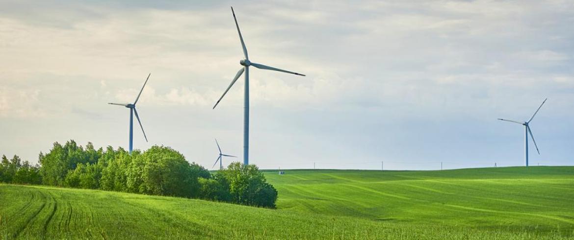 photo of wind turbine in a field
