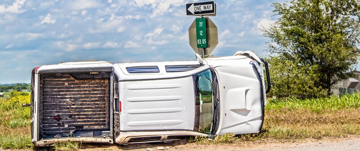 photo of truck overturned on rural highway