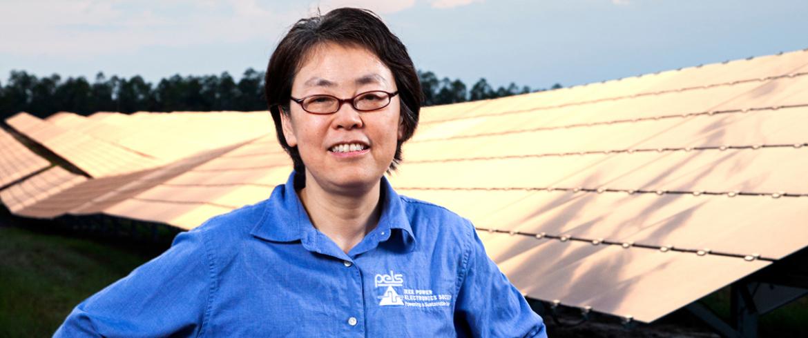 photo of hui helen li in front of a solar array