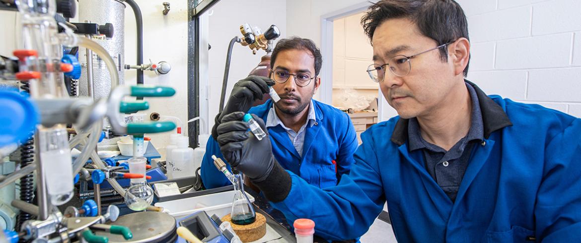 photo of postdoctoral researcher Biswajit Saha and Associate Professor Hoyong Chung in the Dittmer Chemistry Lab at Florida State University